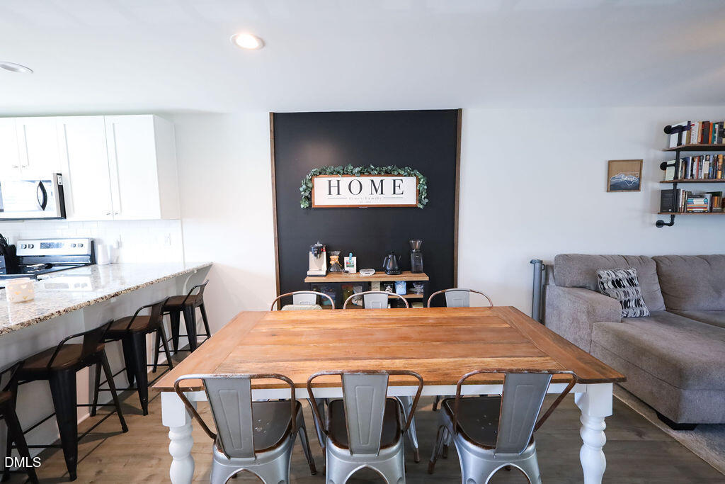 230 South Raleigh Street Angier, NC 27501 - Photo 13 of 38 a view of a dining room with furniture