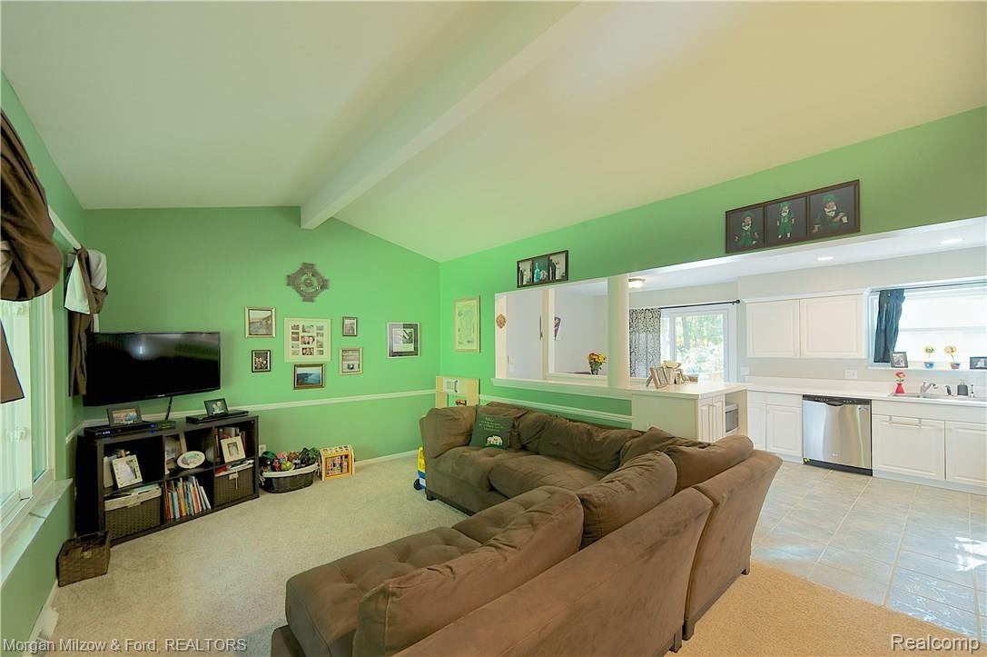 8475 Foster Road Clarkston, MI 48346 - Photo 4 of 35 Living room opens to kitchen