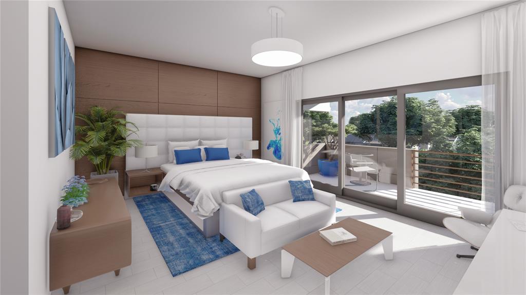 3871 Northeast 23rd Avenue, Unit B Lighthouse Point, FL 33064 - Photo 6 of 12 a bedroom with a large bed and a potted plant