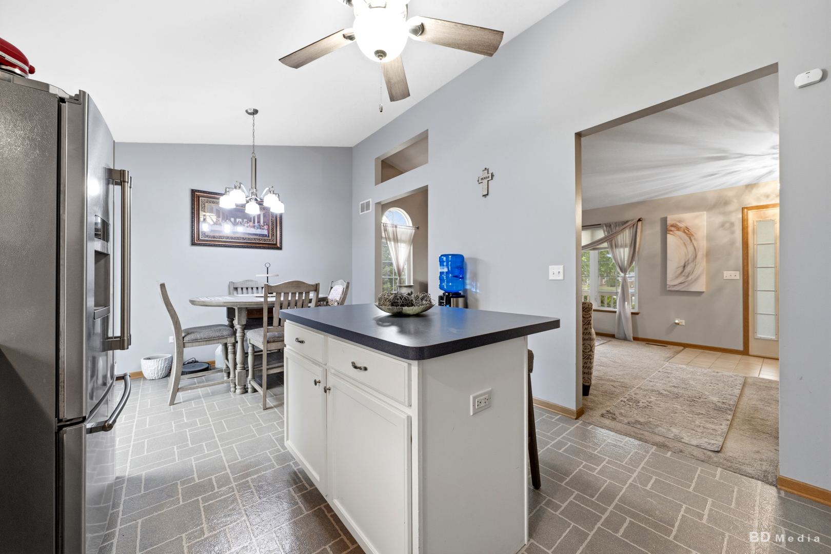 25606 Jonquil Lane Monee, IL 60449 - Photo 12 of 38 a kitchen with stainless steel appliances kitchen island granite countertop a sink and cabinets