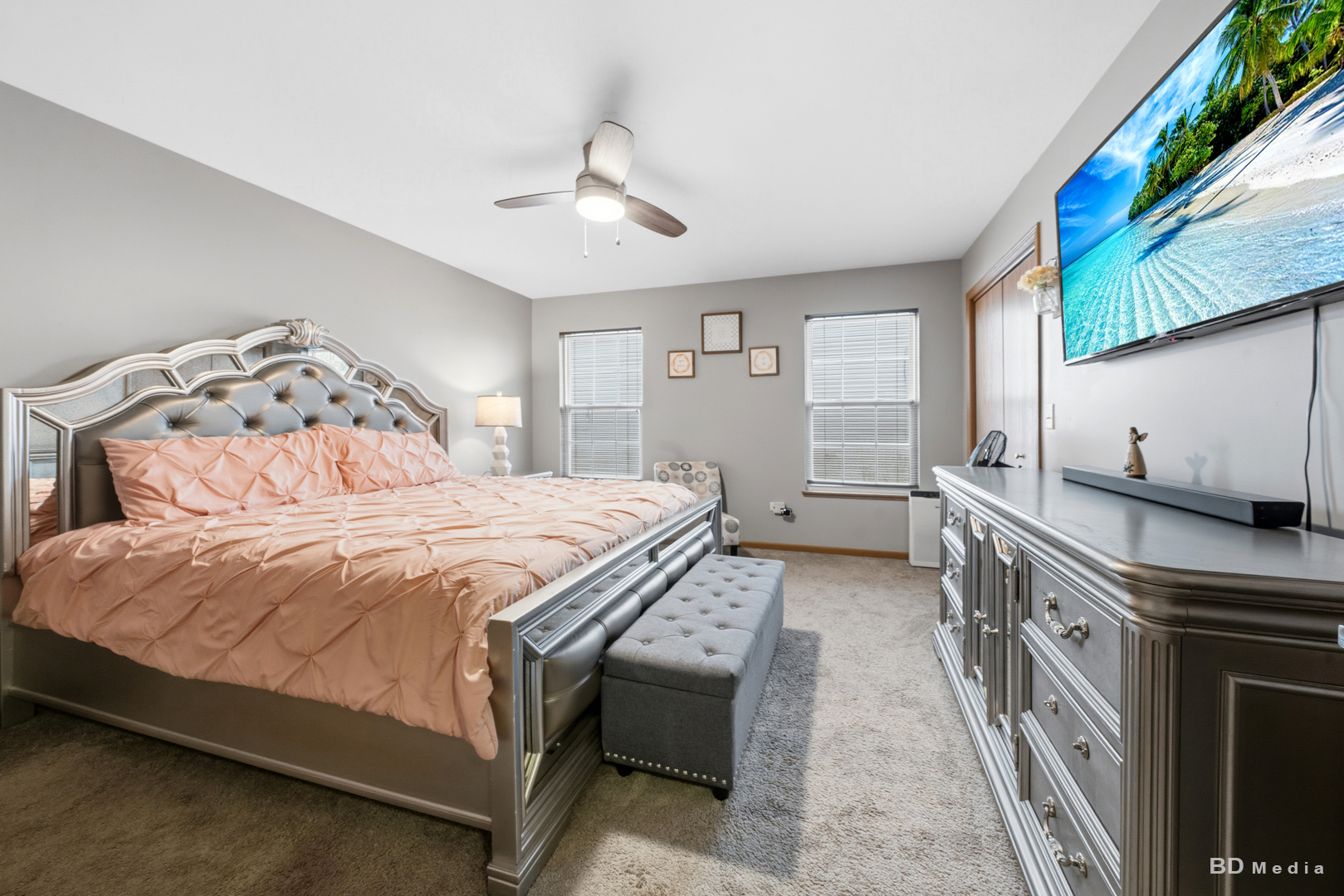 25606 Jonquil Lane Monee, IL 60449 - Photo 16 of 38 a bedroom with a bed and a chandelier