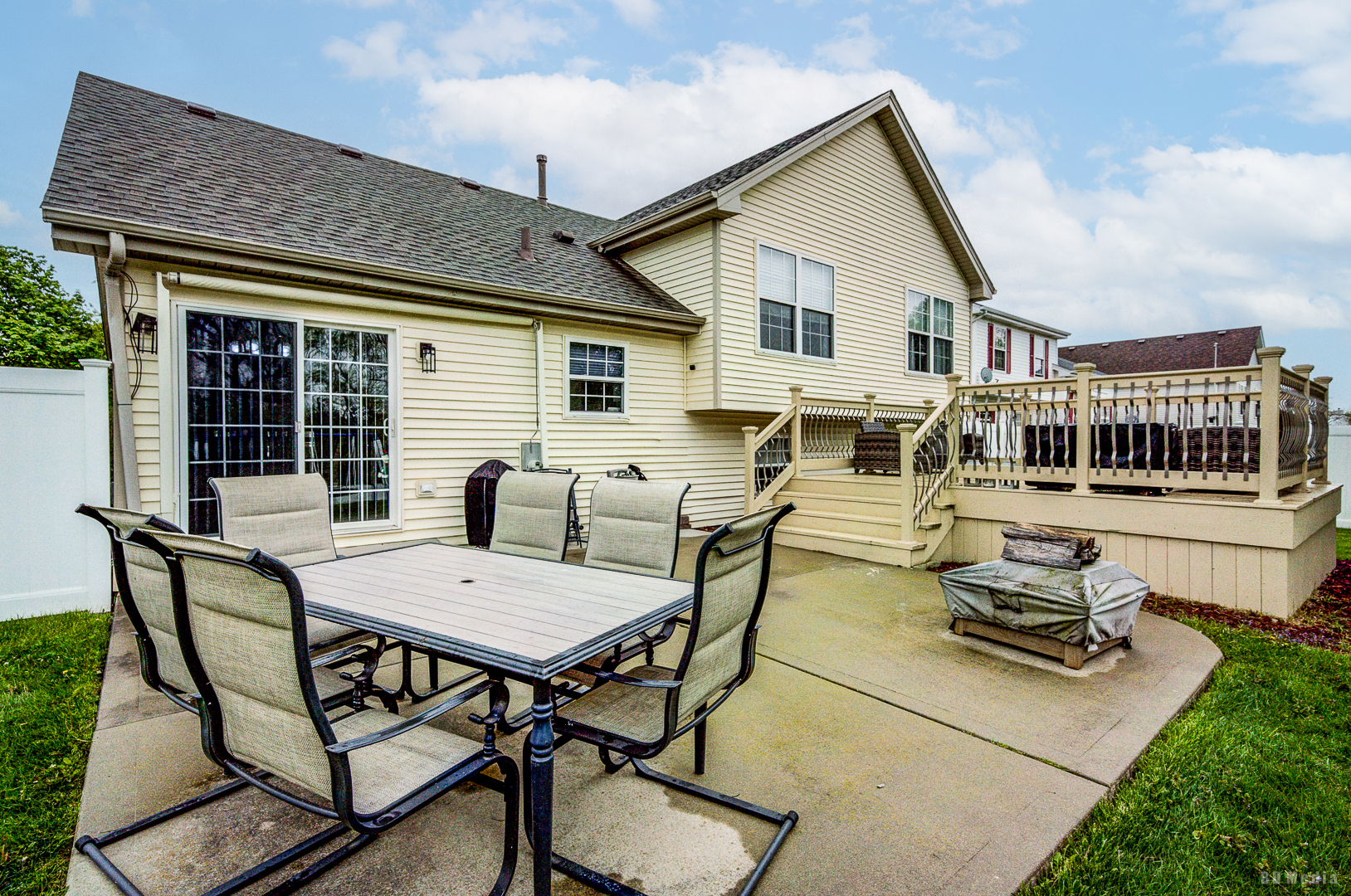 25606 Jonquil Lane Monee, IL 60449 - Photo 32 of 38 a view of a patio with table and chairs with wooden floor and fence