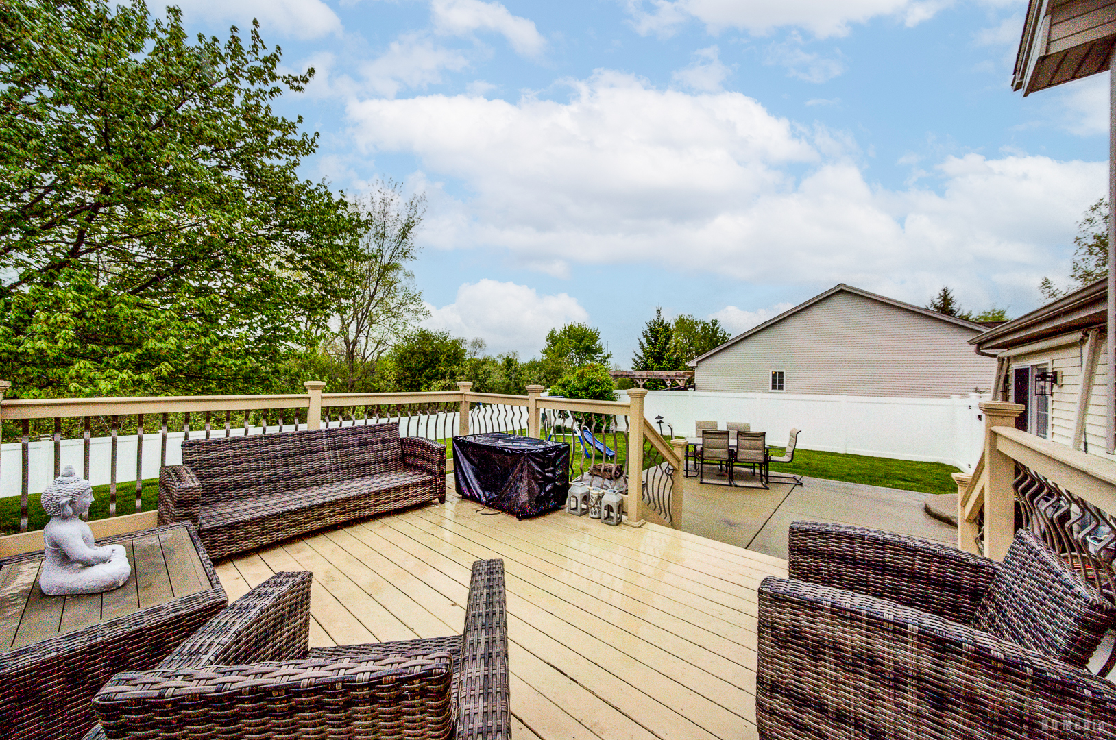 25606 Jonquil Lane Monee, IL 60449 - Photo 33 of 38 a view of a roof deck with a dining table and chairs with wooden floor