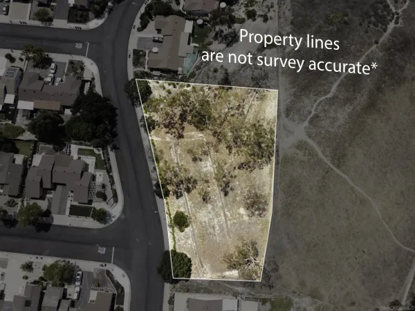 an aerial view of a residential house with outdoor space