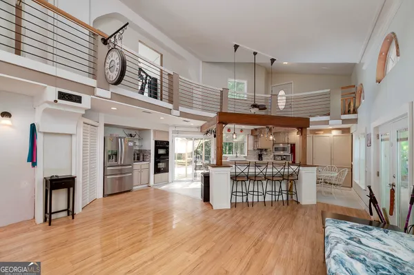 a view of a deck with wooden floor and fence