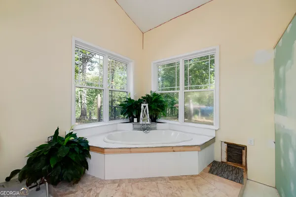 a living room with furniture flat screen tv and a fireplace