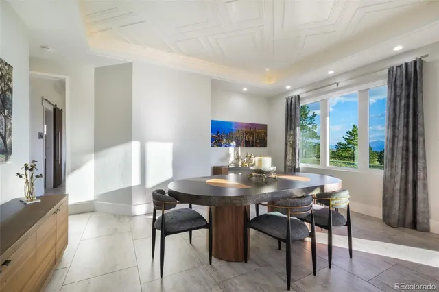 a view of a dining room with furniture and window