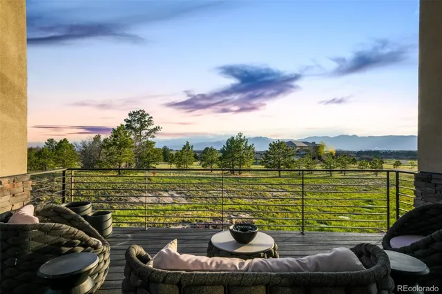a view of a lake with couches in the patio
