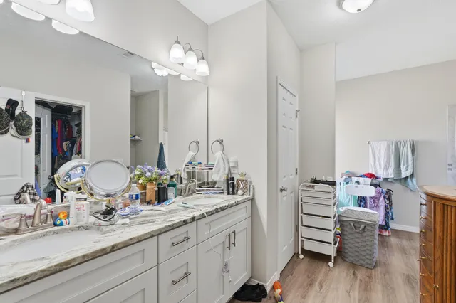 a bathroom with a bathtub sink and mirror