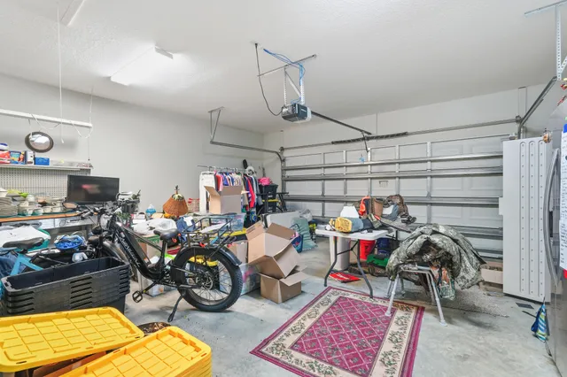 a bathroom with double vanity sinks a vanity two mirror and a window