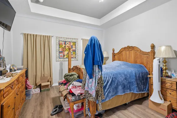 a bedroom with bed and a window