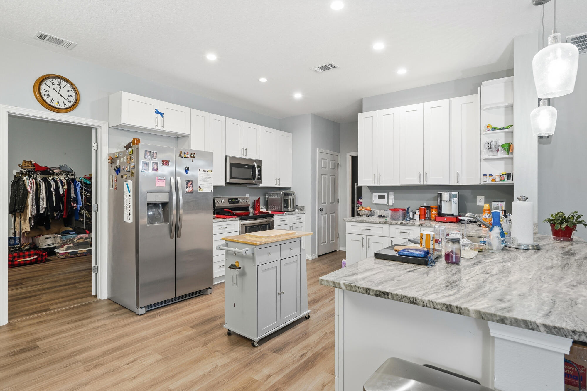 2012 North Pearl Street Crestview, FL 32536 - Photo 7 of 25 a kitchen with stainless steel appliances granite countertop a refrigerator stove microwave and sink