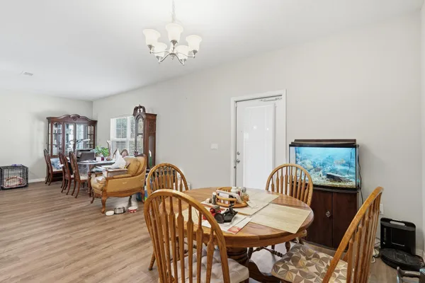 a kitchen that has a lot of cabinets a sink and appliances in it