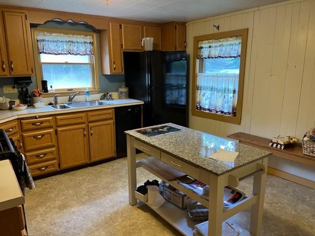 13 Old Fredonia Road Mercer, PA 16137 - Photo 4 of 9 a kitchen with a stove a sink and a refrigerator