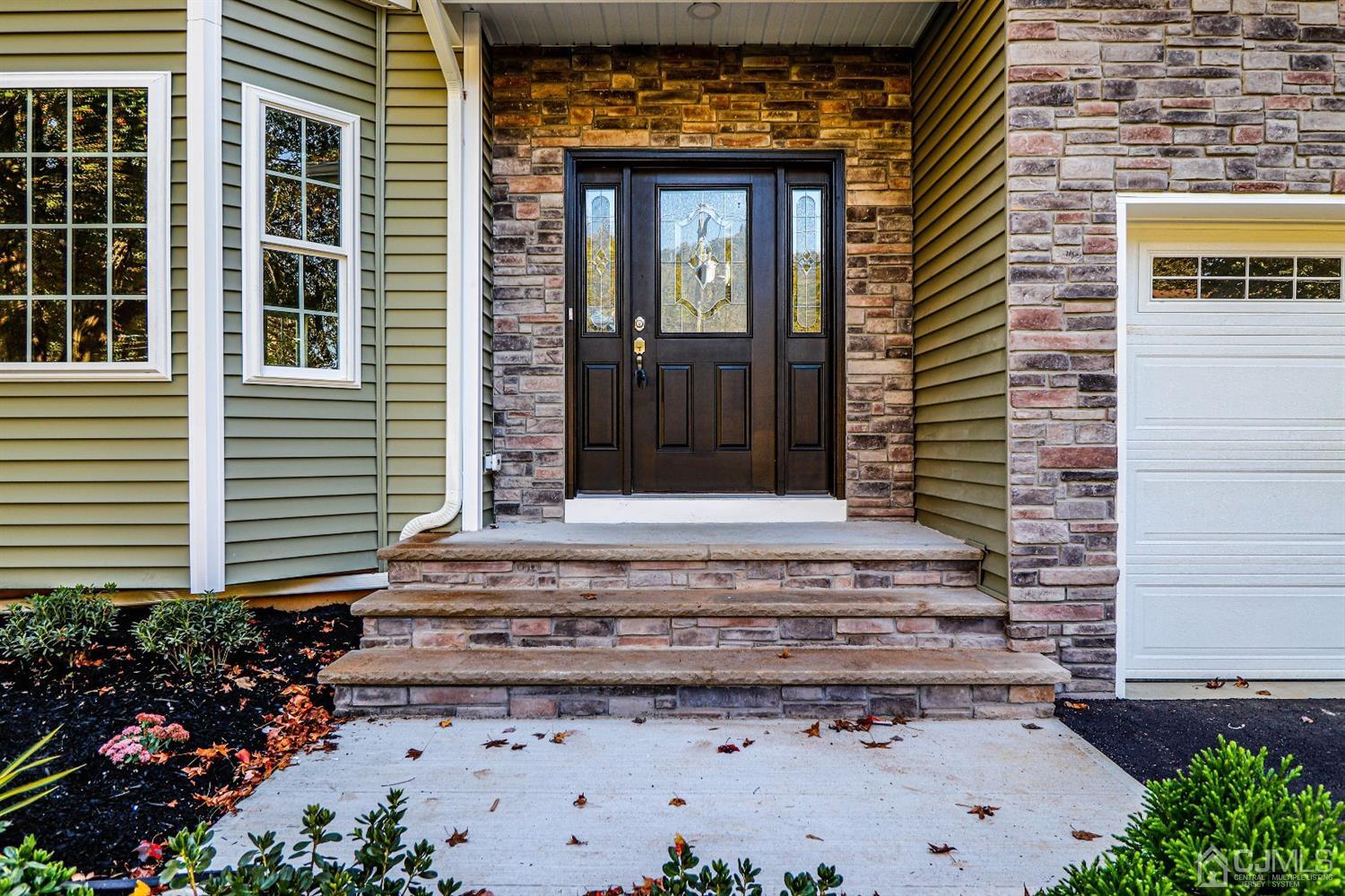 1834 Oak Road North Brunswick, NJ 08902 - Photo 2 of 39 Impressive front door, entrance into this brand new, 4 bedroom, 2 1/2 bath, beautiful brick and vinyl sided 2 story Colonial with two car garage, full basement and attic storage.