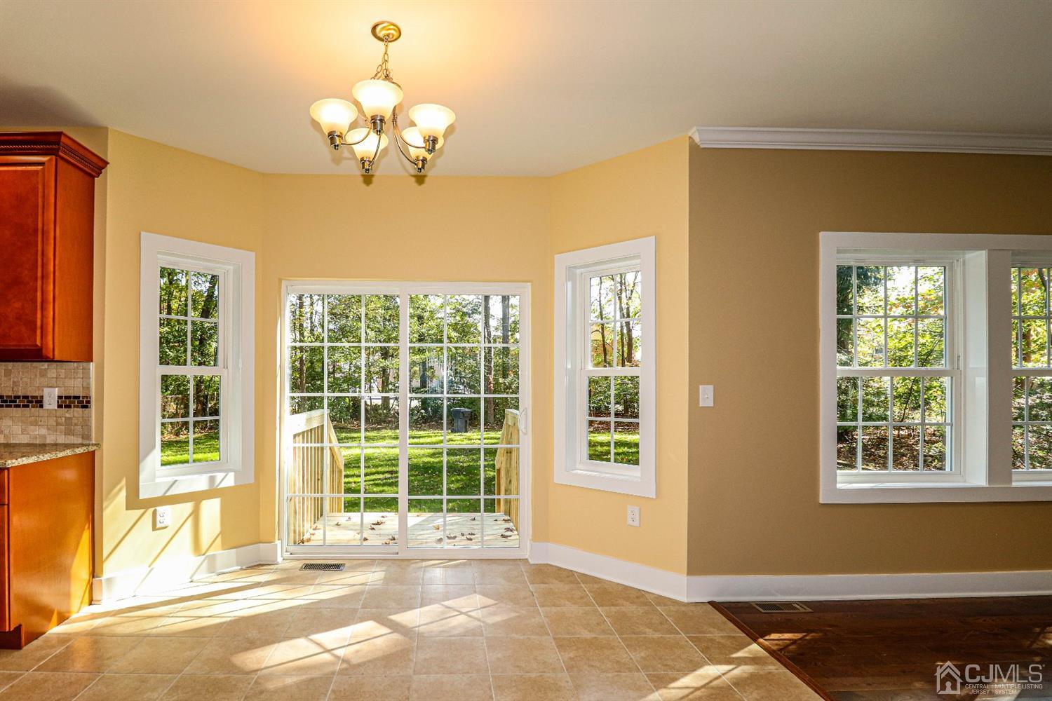 1834 Oak Road North Brunswick, NJ 08902 - Photo 14 of 39 Ceramic tiled eating area, lots of natural light plus chandelier light. Very cheery and bright.