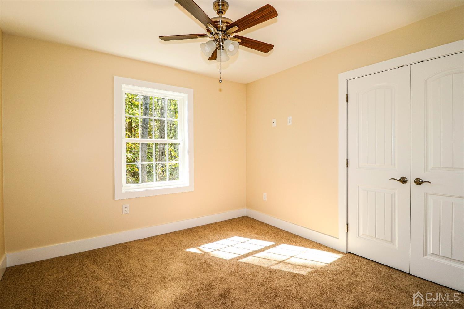 1834 Oak Road North Brunswick, NJ 08902 - Photo 29 of 39 Second bedroom features wall to wall carpeting, ceiling fan and double closet.