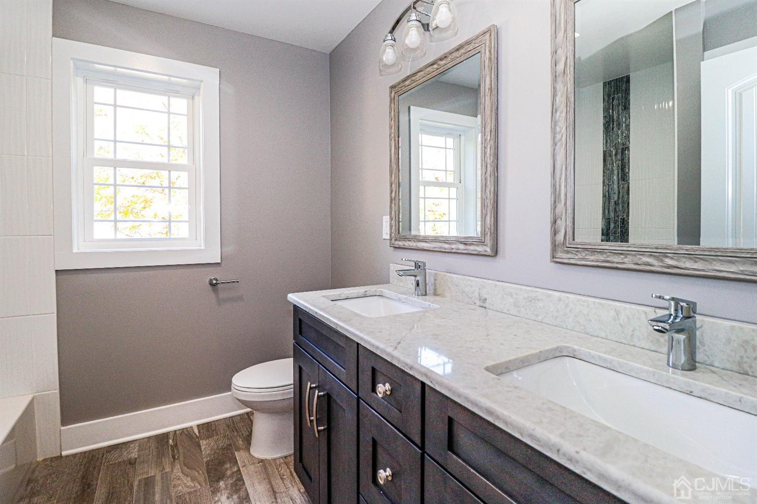 1834 Oak Road North Brunswick, NJ 08902 - Photo 32 of 39 Main bath features double sink, granite countertop, mirrors and vanity storage.