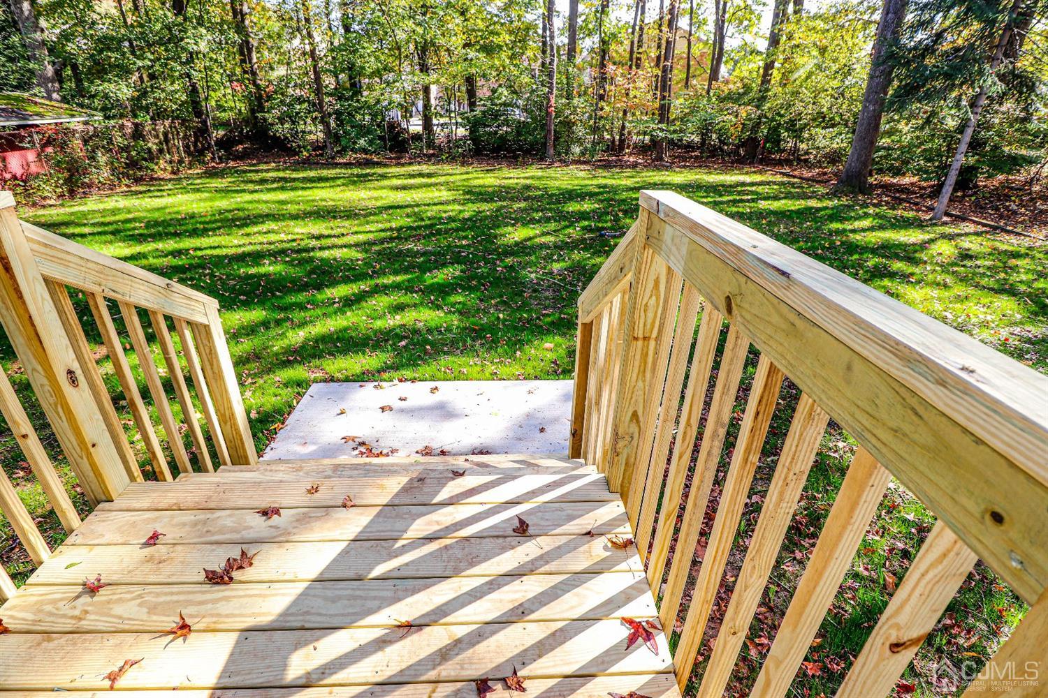 1834 Oak Road North Brunswick, NJ 08902 - Photo 35 of 39 Steps off kitchen eating area that lead to the park like yard.
