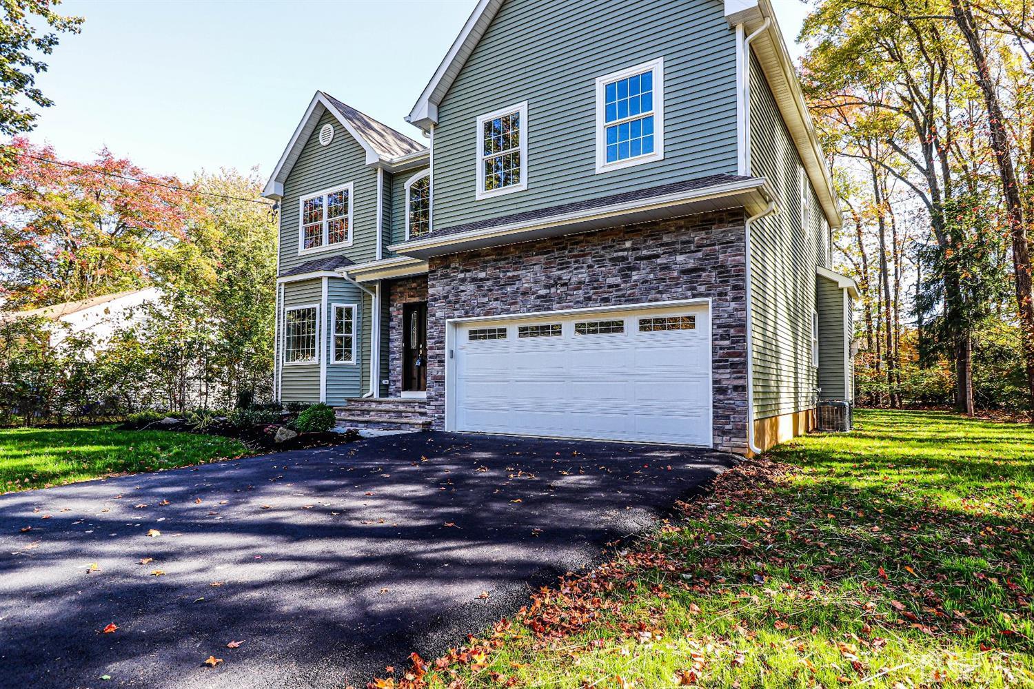 1834 Oak Road North Brunswick, NJ 08902 - Photo 39 of 39 Double blacktop driveway provides plenty of parking along with the built in two car garage with opener.