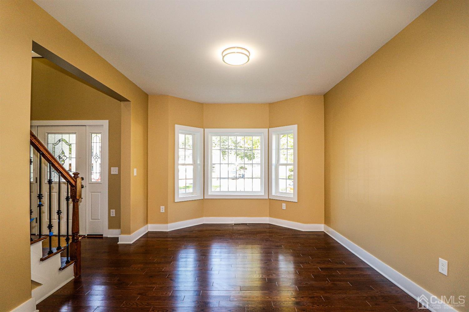 1834 Oak Road North Brunswick, NJ 08902 - Photo 6 of 39 Formal Living room with overhead lighting, wood flooring and pretty front windows allowing lots of natural light throughout this area of this high quality home.