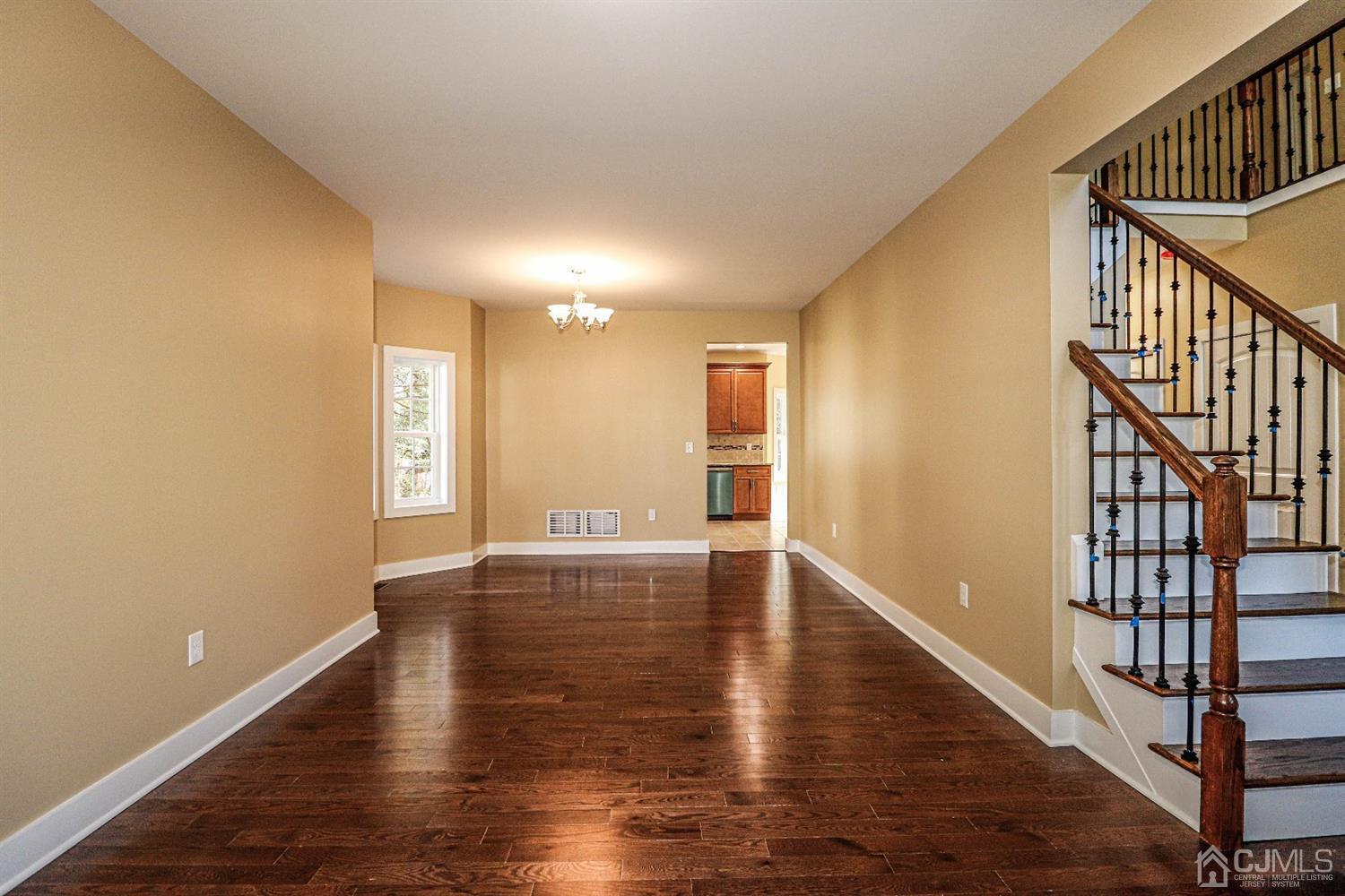 1834 Oak Road North Brunswick, NJ 08902 - Photo 7 of 39 Formal Dining also features wood flooring, chandelier lighting and EZ access to the kitchen.