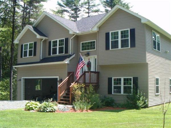 197 Fisherdick Road Ware, MA 01082 - Photo 1 of 30 a front view of a house with a yard and potted plants