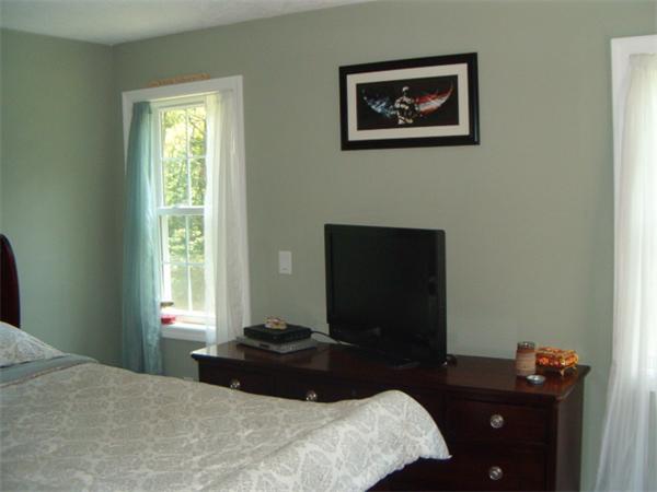 197 Fisherdick Road Ware, MA 01082 - Photo 19 of 30 a bedroom with a bed and a table