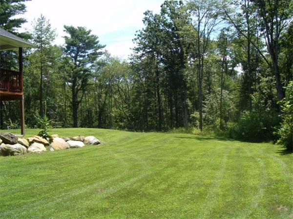 197 Fisherdick Road Ware, MA 01082 - Photo 29 of 30 a view of a grassy field with trees
