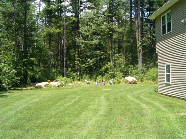 197 Fisherdick Road Ware, MA 01082 - Photo 3 of 30 a backyard of a house with table and chairs