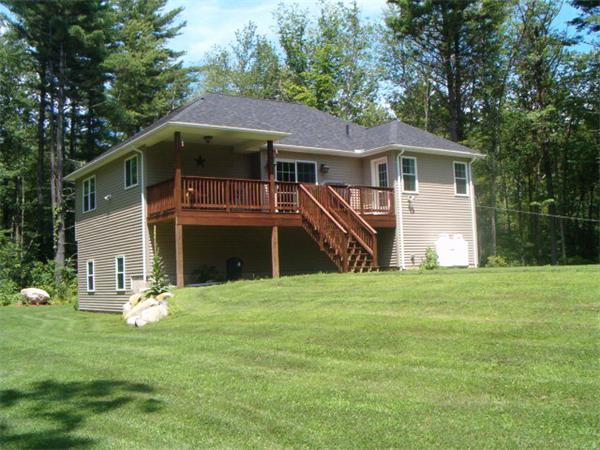 197 Fisherdick Road Ware, MA 01082 - Photo 6 of 30 a front view of a house with a yard and trees