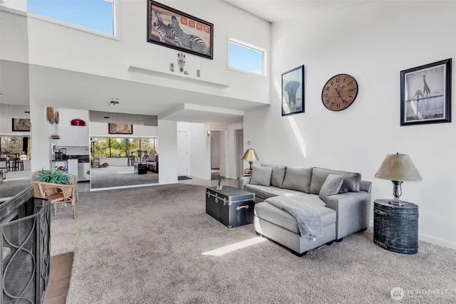 a living room with furniture and a table