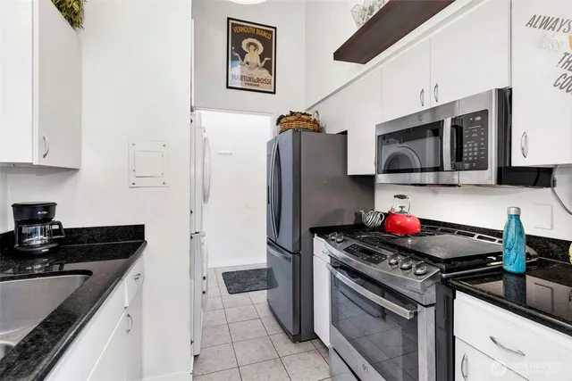 a kitchen with a stove and a microwave