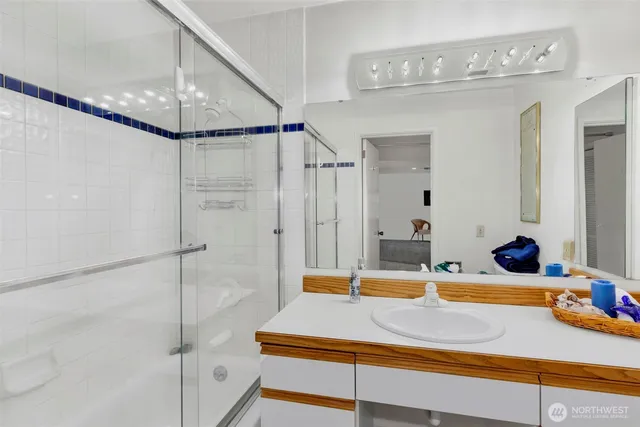 a room with a bed and a chandelier