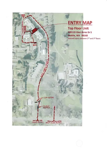 an aerial view of a house with a garden and lake view