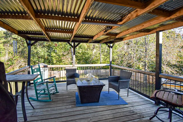 a view of sitting area with furniture and wooden floor