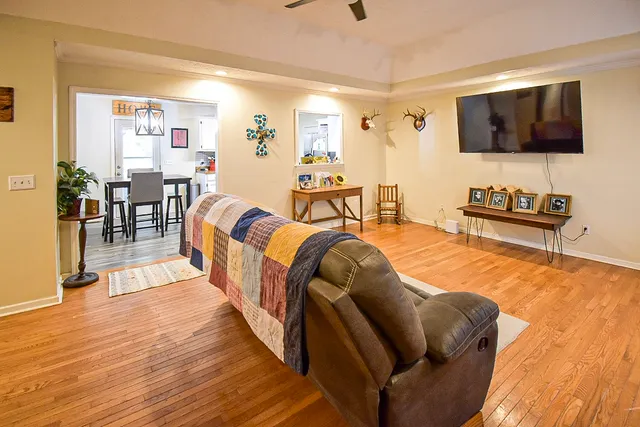 a living room with furniture and a flat screen tv