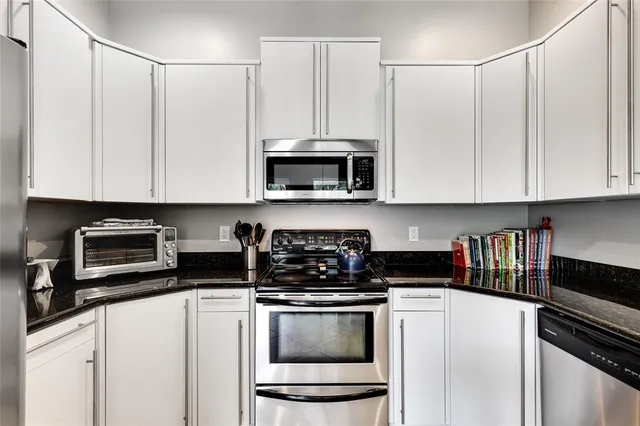 a bathroom with a granite countertop sink mirror and double