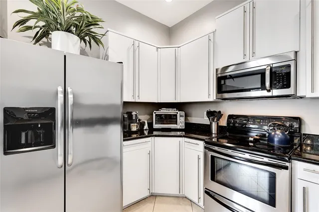 a bedroom with a bed and a lamp