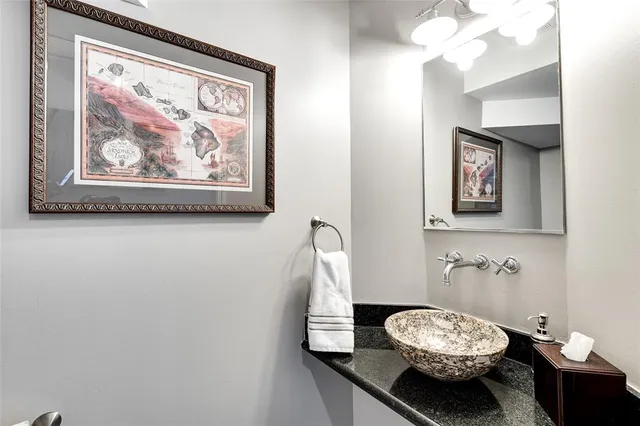 a living room with furniture and a book shelf