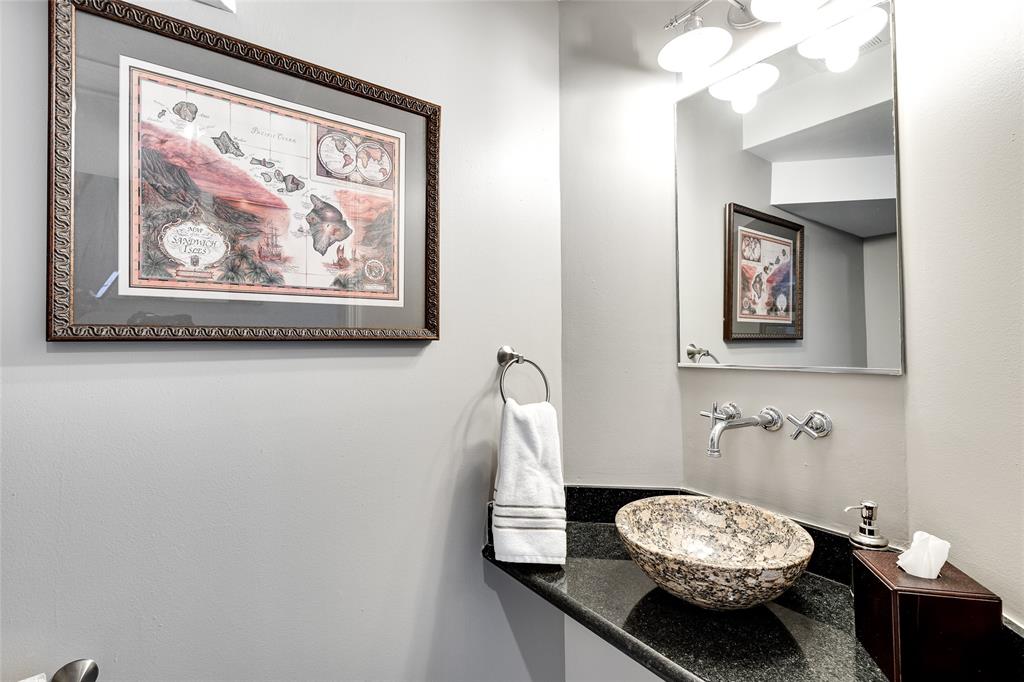 1224 Northeast 18th Avenue, Unit 1 Fort Lauderdale, FL 33304 - Photo 13 of 34 a bathroom with a toilet a sink and mirror