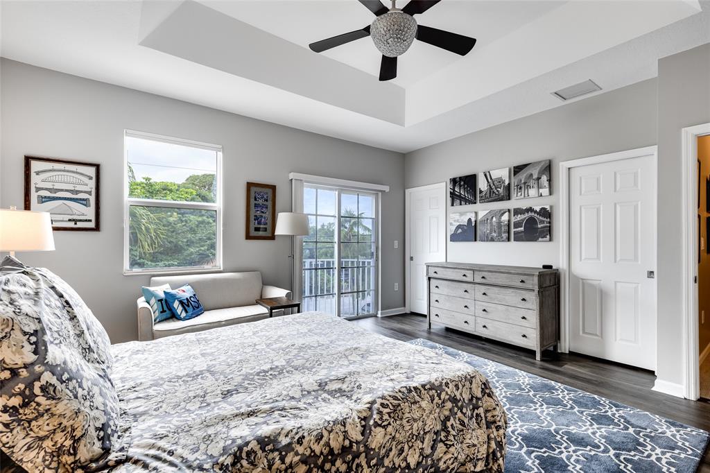 1224 Northeast 18th Avenue, Unit 1 Fort Lauderdale, FL 33304 - Photo 16 of 34 a bedroom with a bed dresser and a window