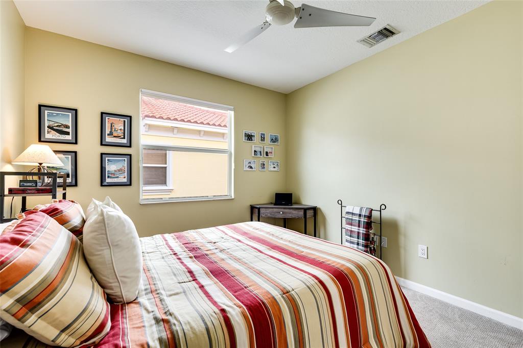 1224 Northeast 18th Avenue, Unit 1 Fort Lauderdale, FL 33304 - Photo 21 of 34 a bedroom with double bed and a window