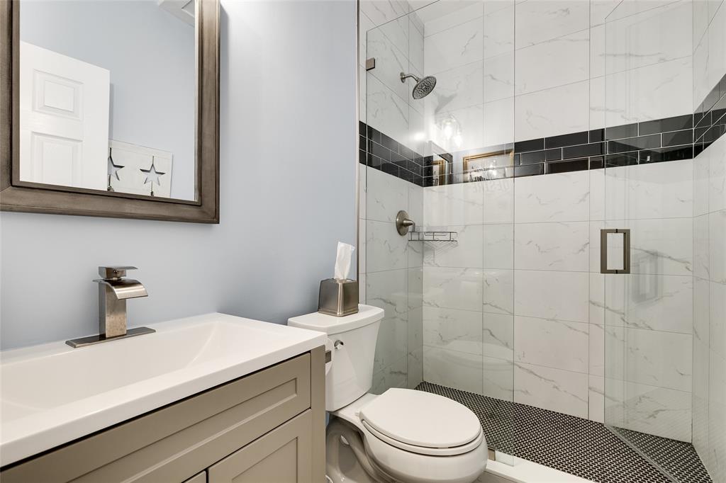 1224 Northeast 18th Avenue, Unit 1 Fort Lauderdale, FL 33304 - Photo 23 of 34 a bathroom with a sink a toilet and shower