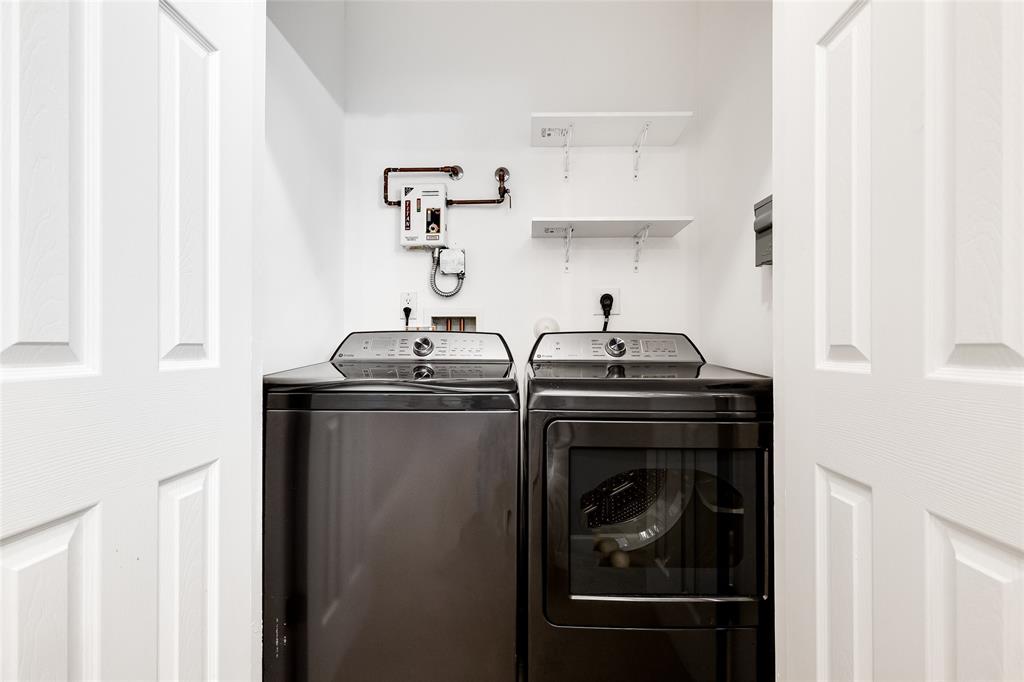 1224 Northeast 18th Avenue, Unit 1 Fort Lauderdale, FL 33304 - Photo 26 of 34 a close view of a sink and a stove in a kitchen