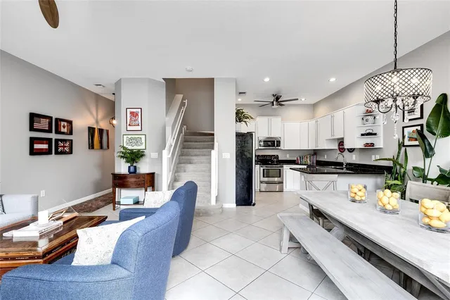 a kitchen with stainless steel appliances granite countertop a stove and a refrigerator