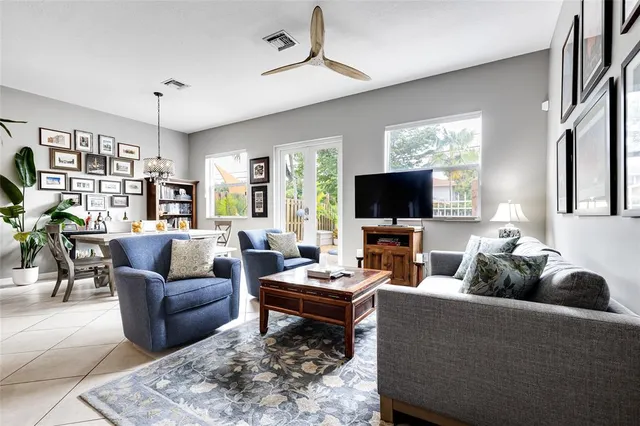 a kitchen with granite countertop a sink stainless steel appliances and white cabinets