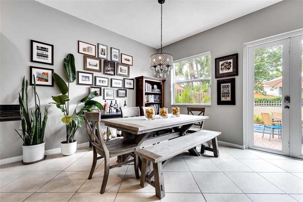 1224 Northeast 18th Avenue, Unit 1 Fort Lauderdale, FL 33304 - Photo 9 of 34 a living room with furniture a window and a potted plant