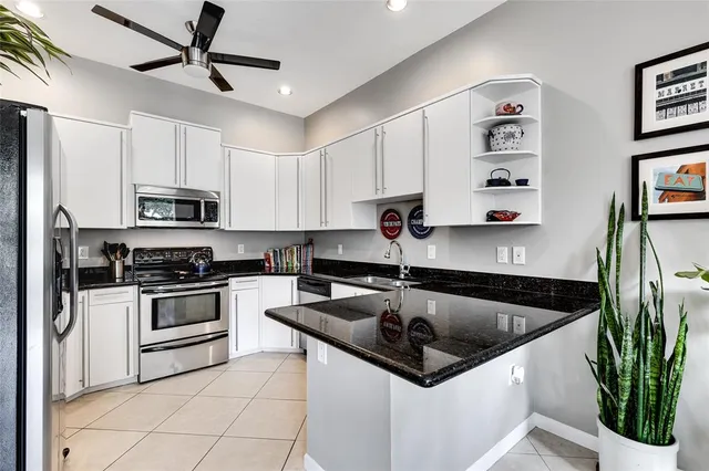 a bedroom with a bed dresser and a window