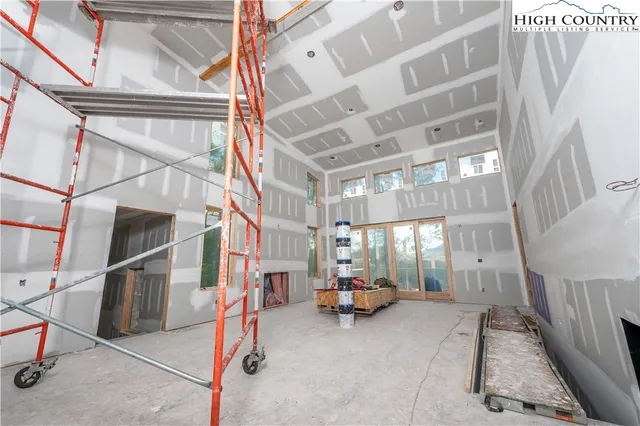 a bedroom with bed and window